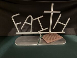 Silver (fund raiser) FAITH sign